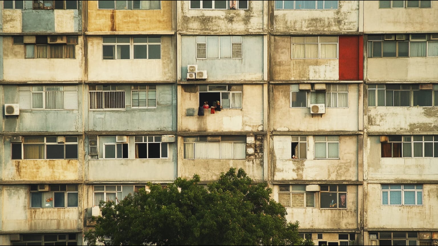 AI-generated hero image: Dense urban neighborhood under extreme heat, concrete apartment blocks with sharp shadows, thermal haze, figures seeking shade